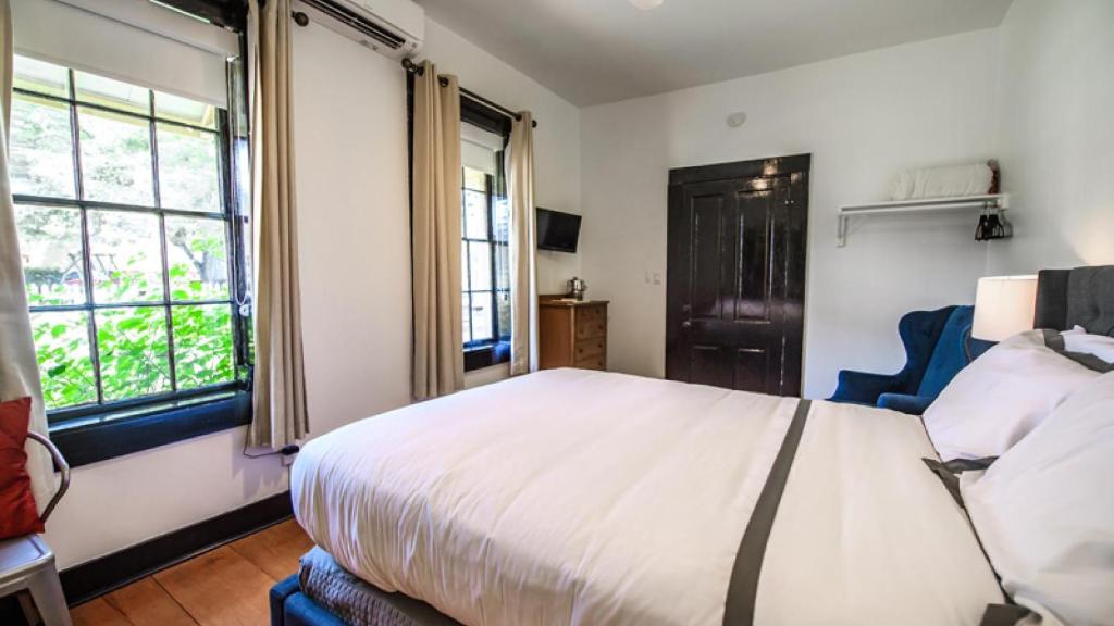 Postel nebo postele na pokoji v ubytování Hotel Giles