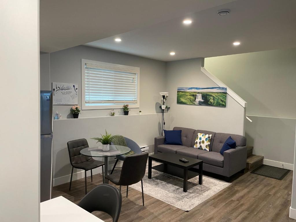 a living room with a couch and a table at Hamm Suite in Saskatoon