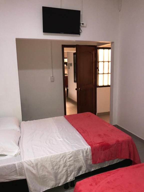 Postel nebo postele na pokoji v ubytování Hotel Buganvilla