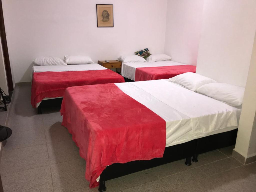 Postel nebo postele na pokoji v ubytování Hotel Buganvilla