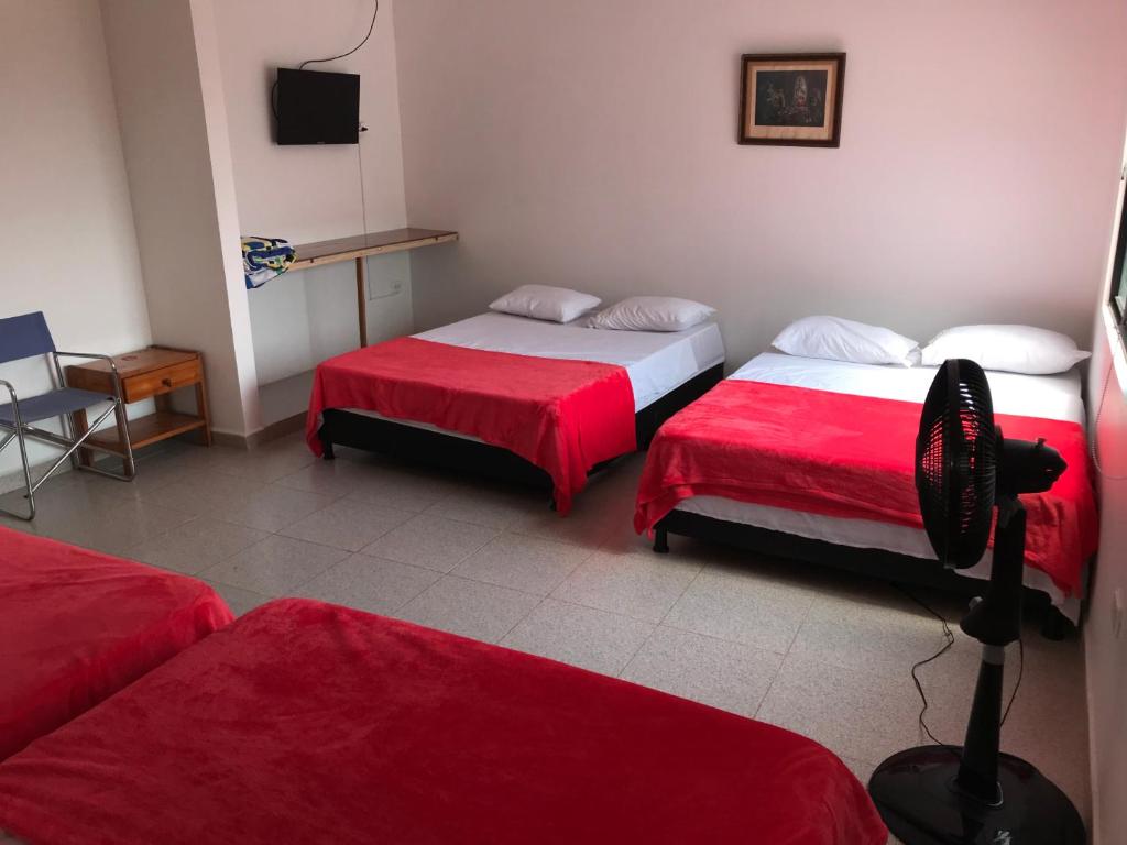 Postel nebo postele na pokoji v ubytování Hotel Buganvilla