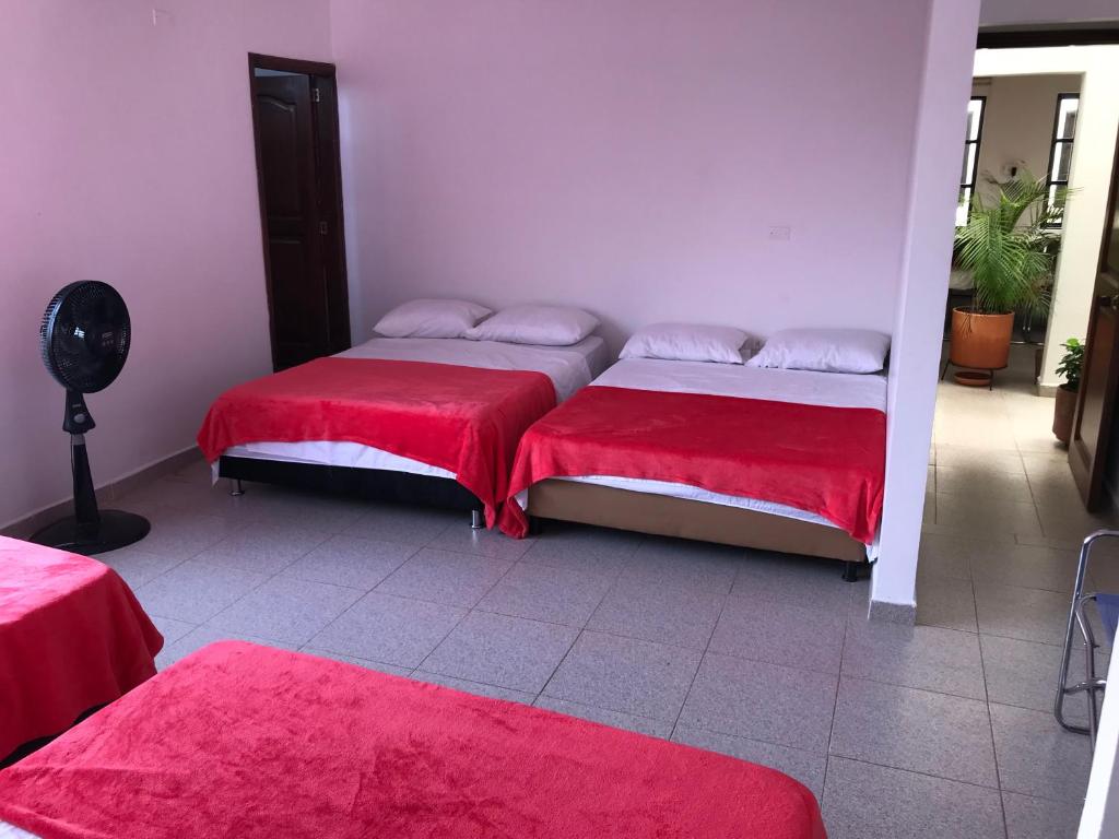 Postel nebo postele na pokoji v ubytování Hotel Buganvilla