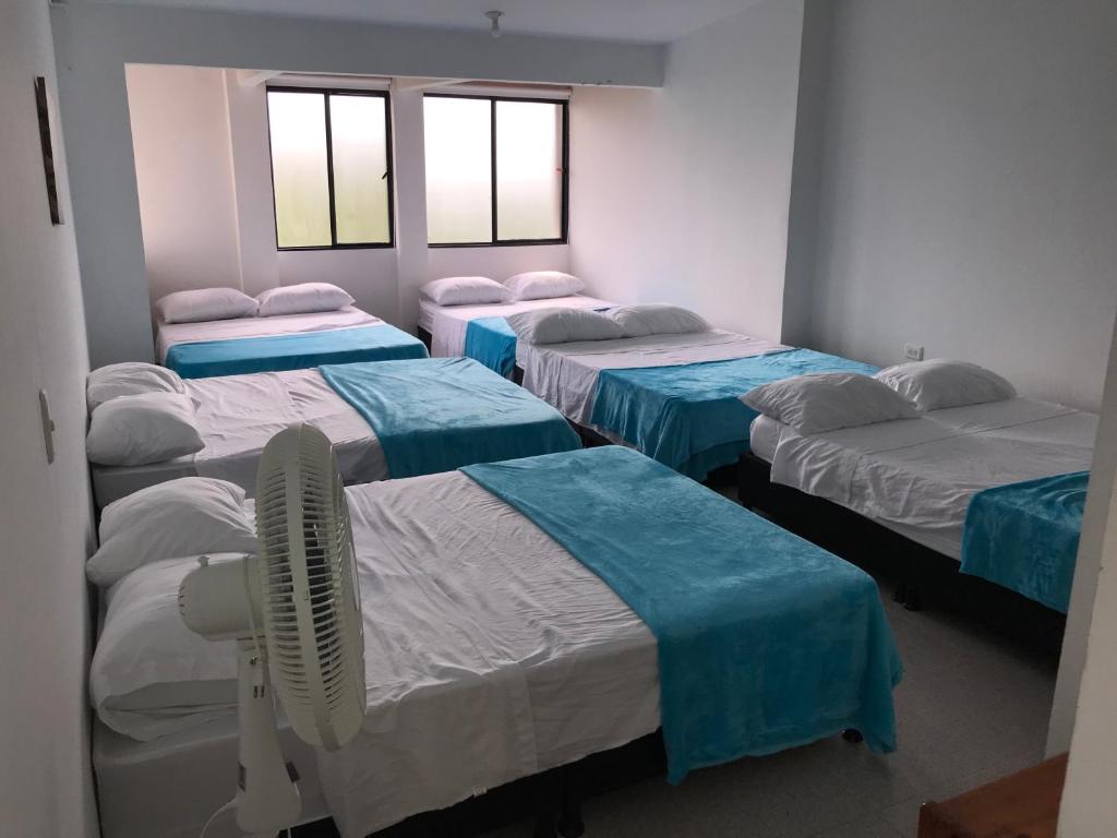 Postel nebo postele na pokoji v ubytování Hotel Buganvilla
