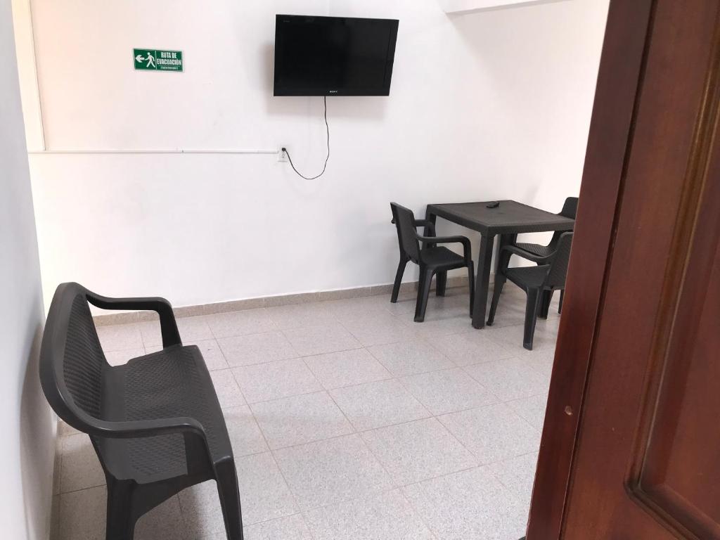 TV a/nebo společenská místnost v ubytování Hotel Buganvilla