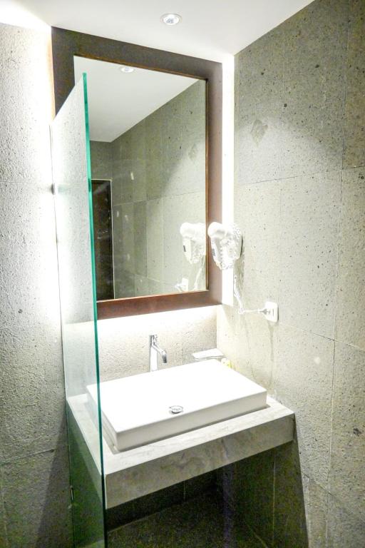 Koupelna v ubytování Odaita Hotel Pamekasan Madura