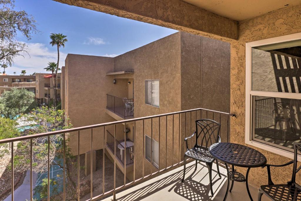 a balcony with chairs and a table at Lake Havasu City Condo with Resort Amenities! in Lake Havasu City