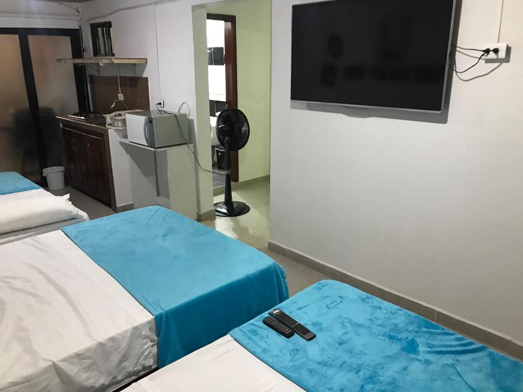 TV a/nebo společenská místnost v ubytování Hotel Buganvilla