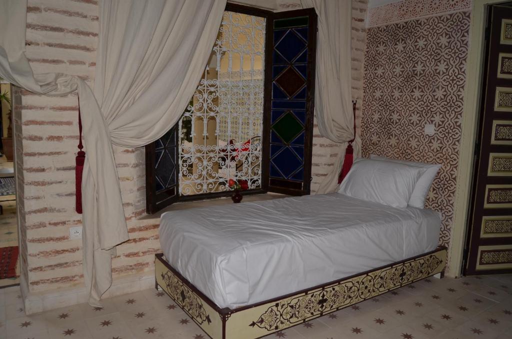 Postel nebo postele na pokoji v ubytování Riad Dar Hamid Hotel & Spa