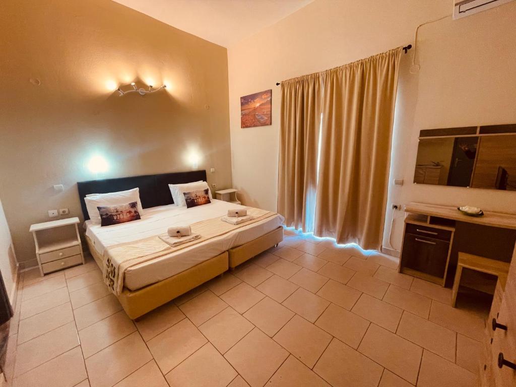 Postel nebo postele na pokoji v ubytování Sidari Vibes Aparthotel