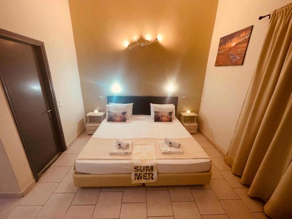 Postel nebo postele na pokoji v ubytování Sidari Vibes Aparthotel