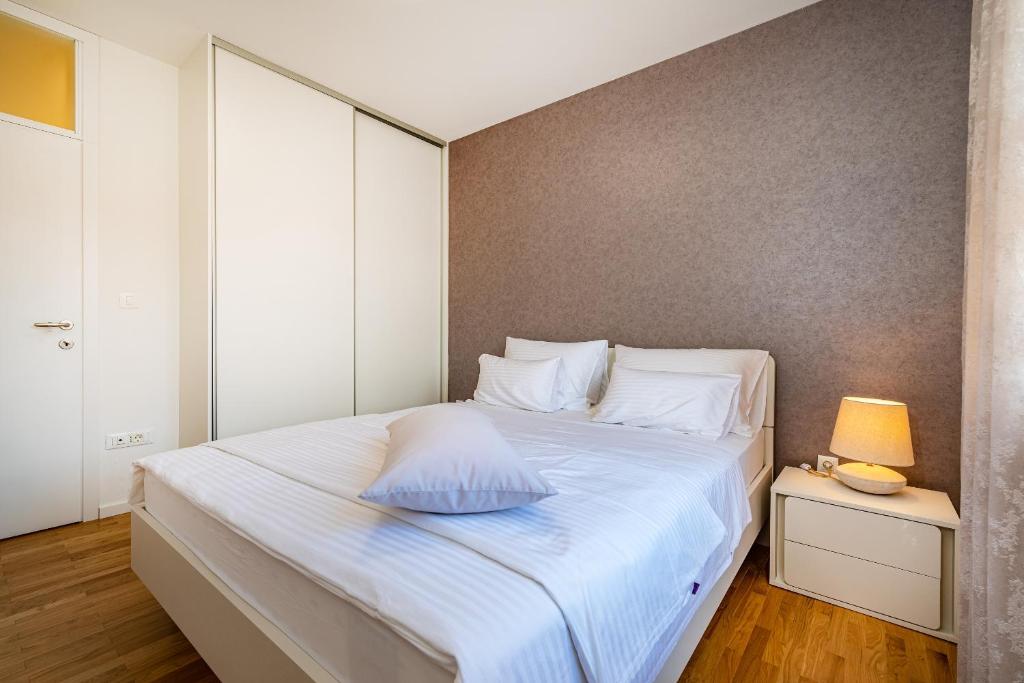 Posteľ alebo postele v izbe v ubytovaní Apartment Oasis