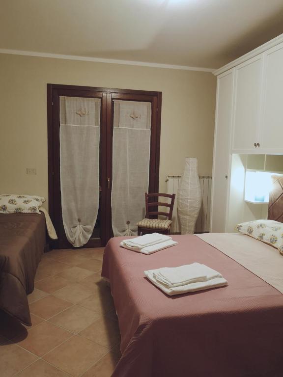 Łóżko lub łóżka w pokoju w obiekcie Villa Terrena