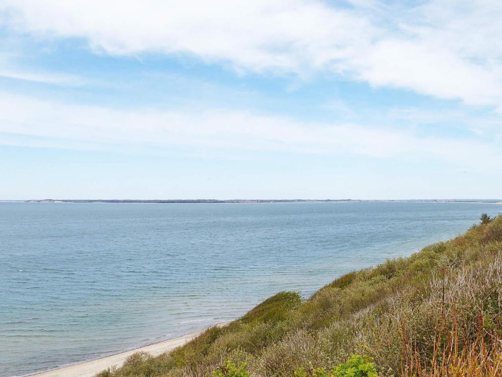 a view of a beach with the ocean in the background at 6 person holiday home in Struer-By Traum in Struer