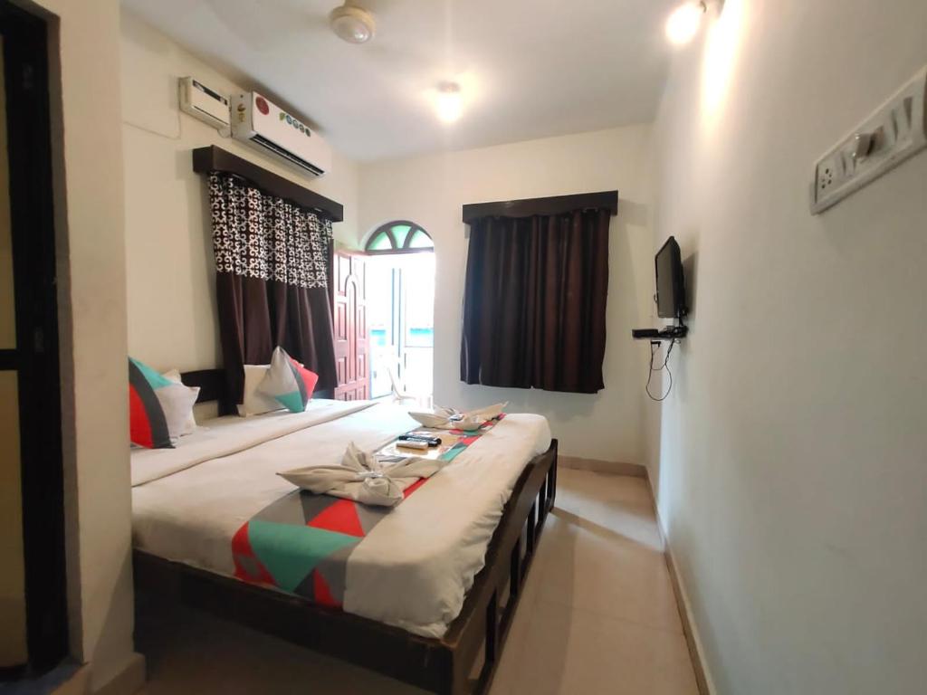 Postel nebo postele na pokoji v ubytování RJ14 Accommodations at Baga Beach