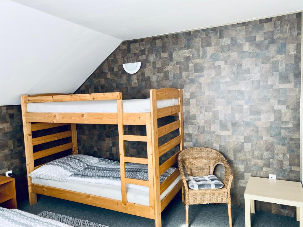 Postel nebo postele na pokoji v ubytování Apartmány na Horce