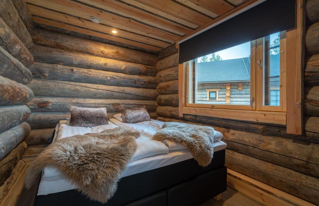 Postel nebo postele na pokoji v ubytování Wilderness Hotel Inari & Igloos