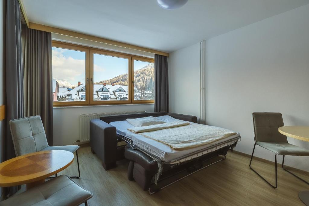 Postel nebo postele na pokoji v ubytování Vitranc Apartments