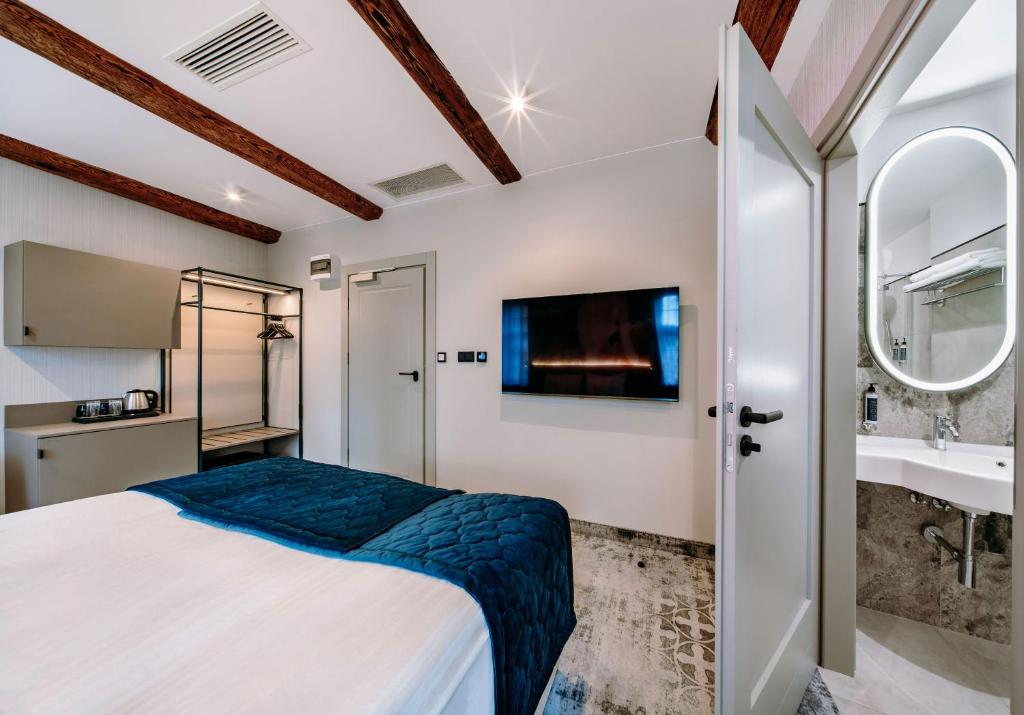 Postel nebo postele na pokoji v ubytování Hotel ETER