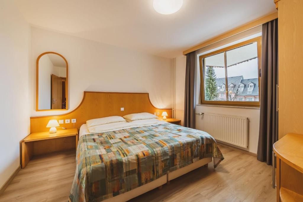 Postel nebo postele na pokoji v ubytování Vitranc Apartments
