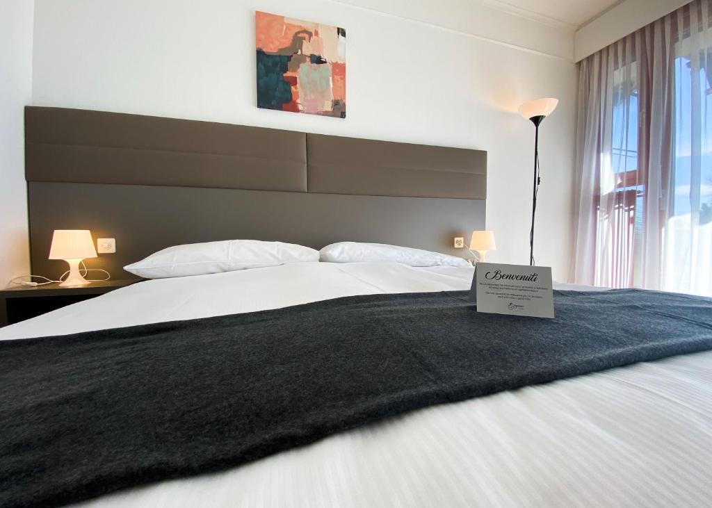 Postel nebo postele na pokoji v ubytování Hotel Serpiano