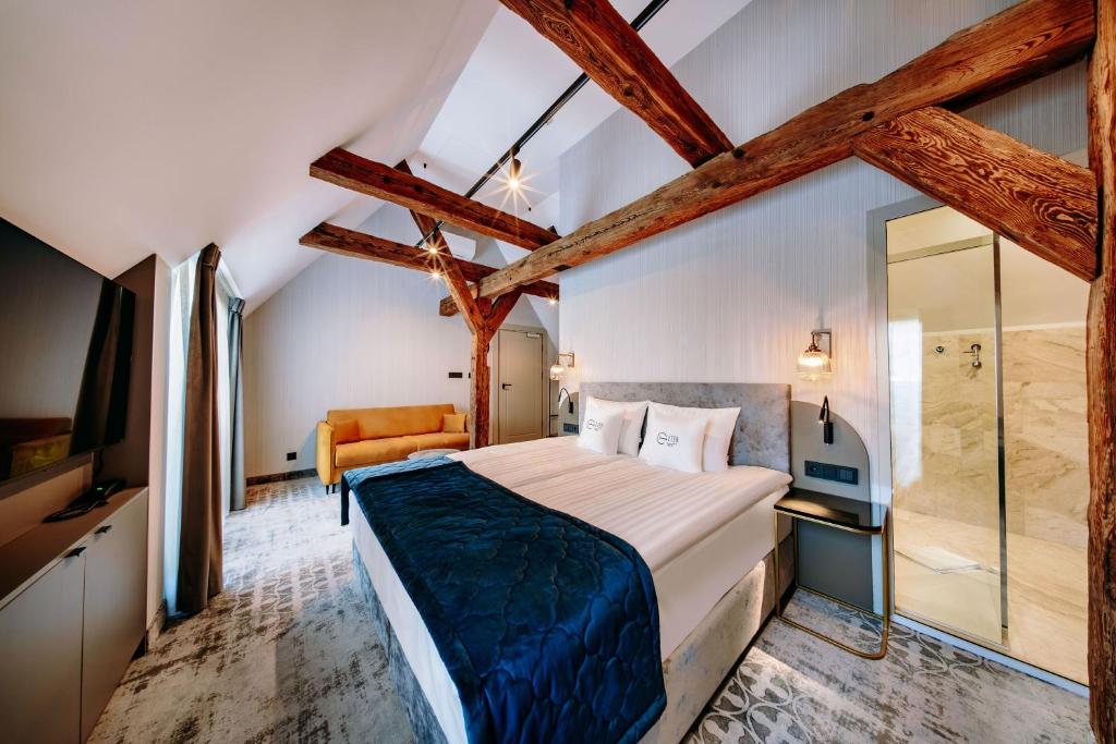 Postel nebo postele na pokoji v ubytování Hotel ETER