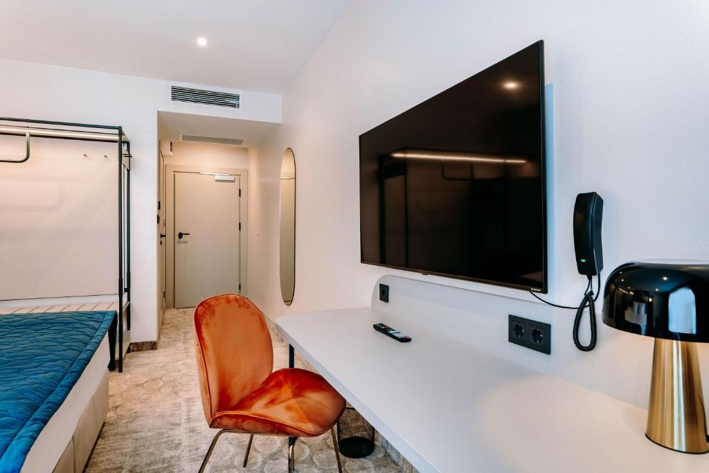 TV a/nebo společenská místnost v ubytování Hotel ETER