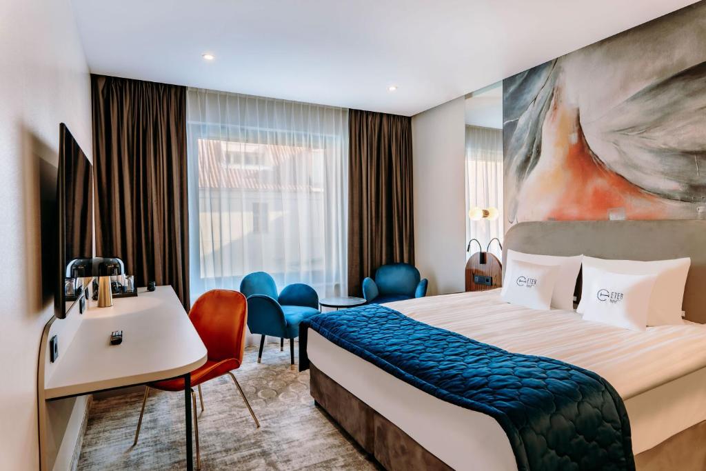 Postel nebo postele na pokoji v ubytování Hotel ETER