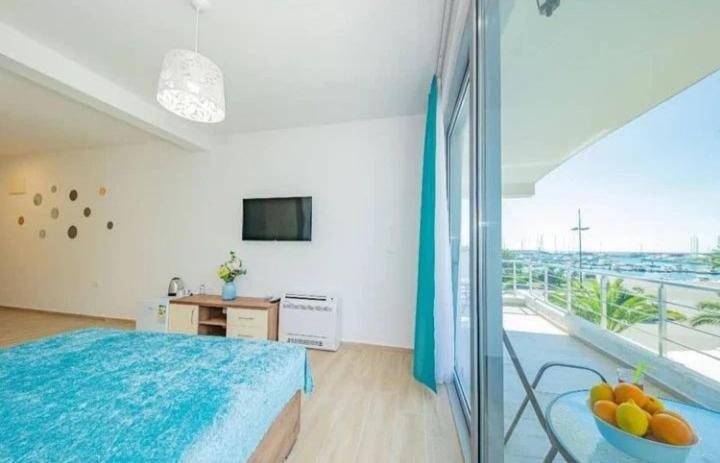 TV a/nebo společenská místnost v ubytování Passerella Apartments