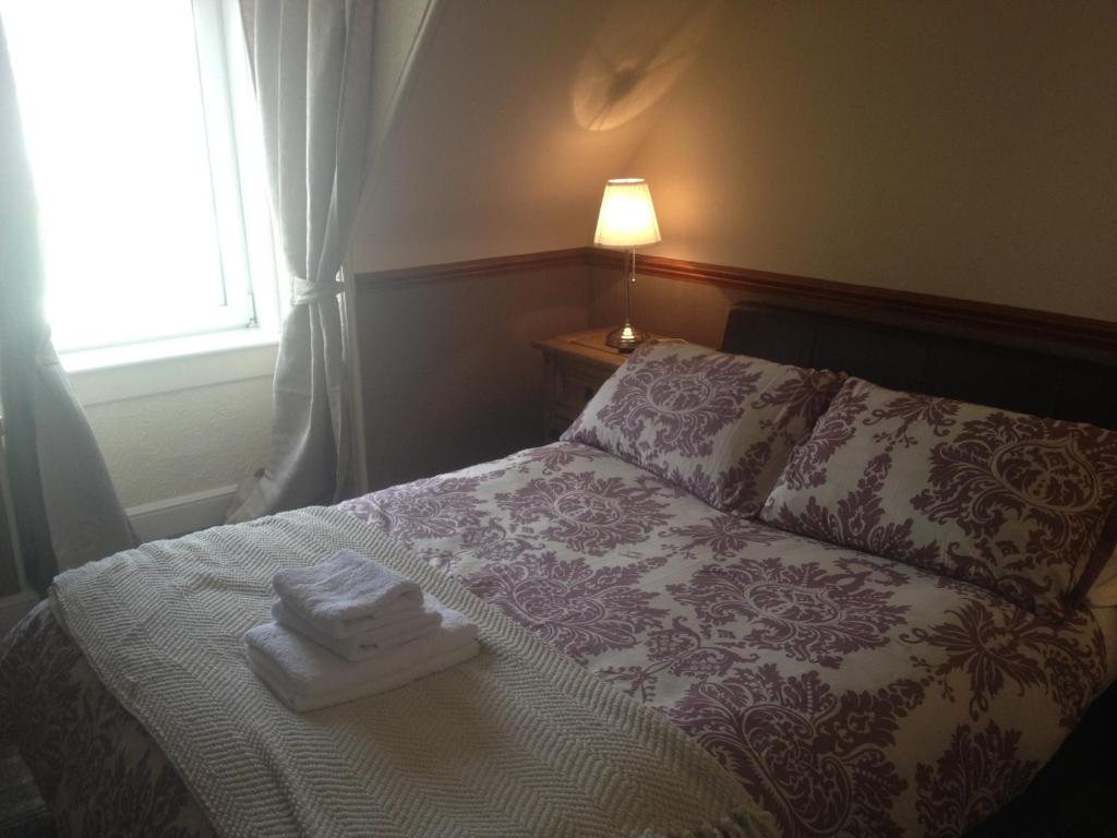 Ein Bett oder Betten in einem Zimmer der Unterkunft Glengorm Guest House