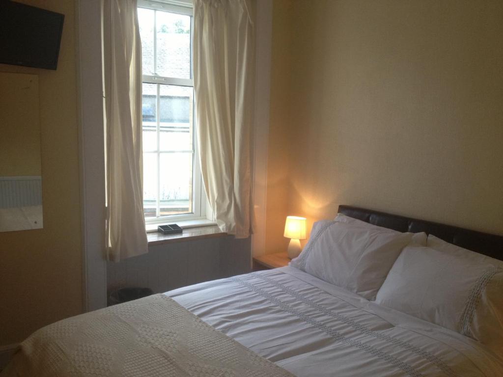 Ein Bett oder Betten in einem Zimmer der Unterkunft Glengorm Guest House