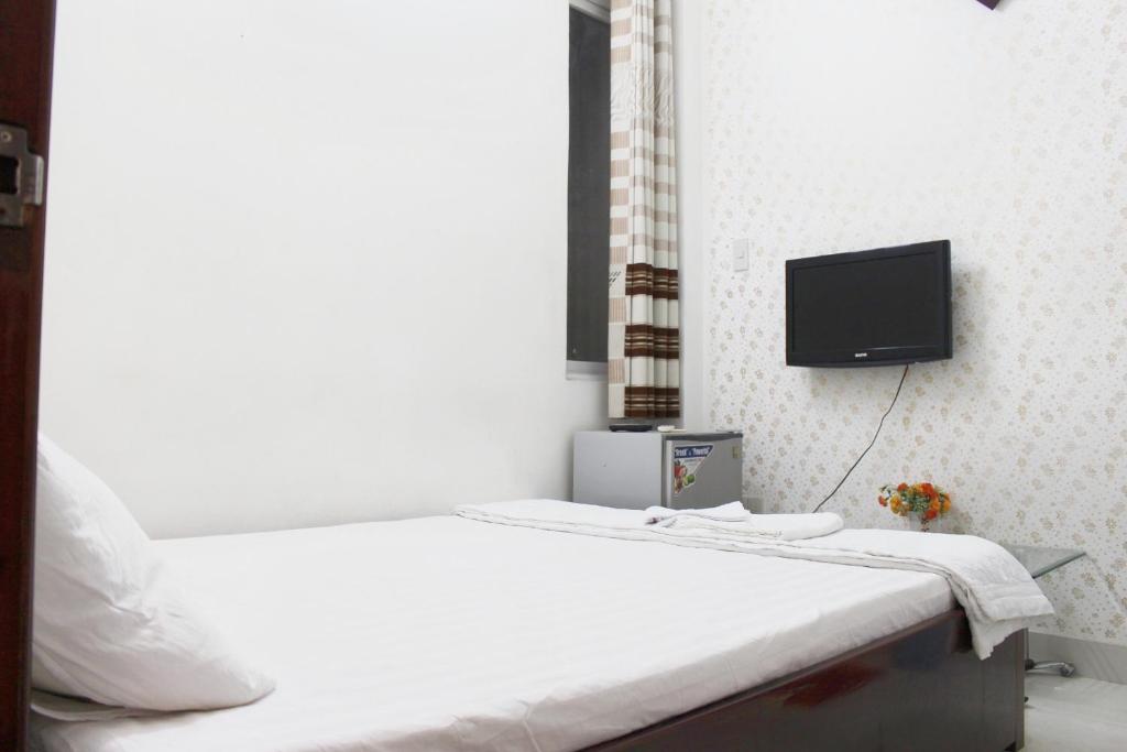 Postel nebo postele na pokoji v ubytování Mai Guest House