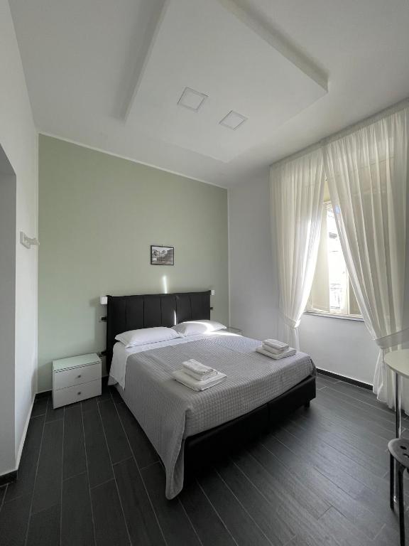 Posteľ alebo postele v izbe v ubytovaní Le Porte di Napoli - Rooms