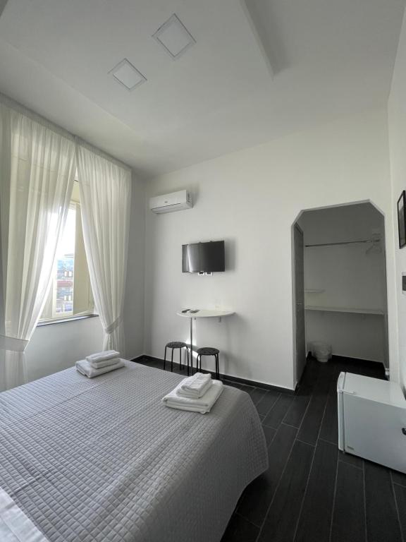 Posteľ alebo postele v izbe v ubytovaní Le Porte di Napoli - Rooms