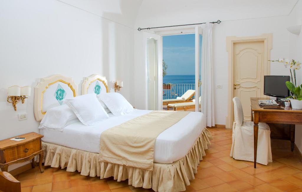 Postel nebo postele na pokoji v ubytování Hotel L'Ancora