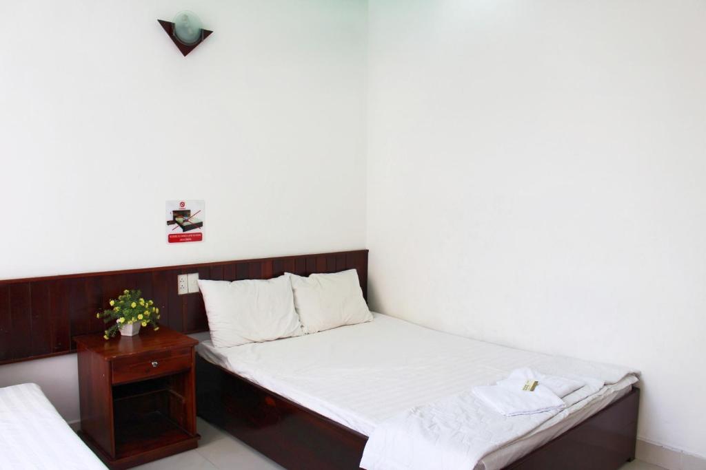 Postel nebo postele na pokoji v ubytování Mai Guest House