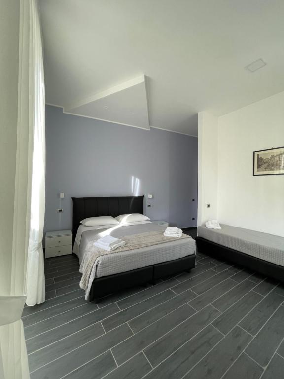 Posteľ alebo postele v izbe v ubytovaní Le Porte di Napoli - Rooms