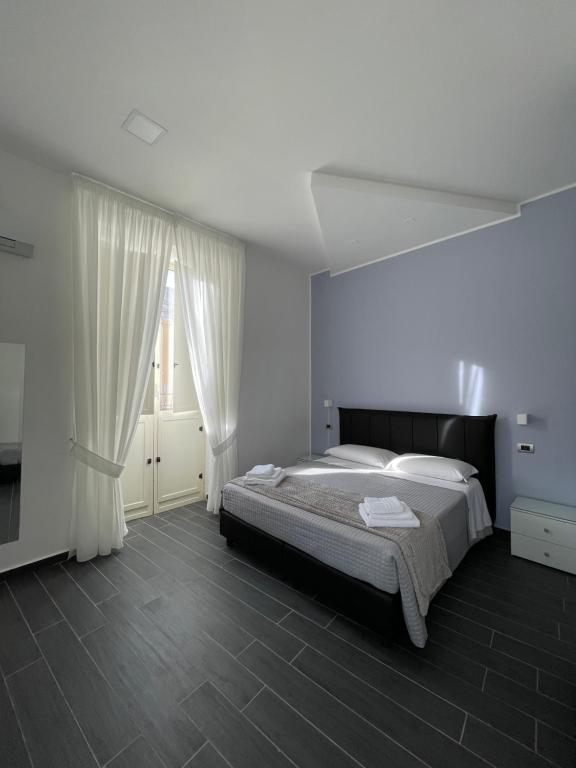 Posteľ alebo postele v izbe v ubytovaní Le Porte di Napoli - Rooms