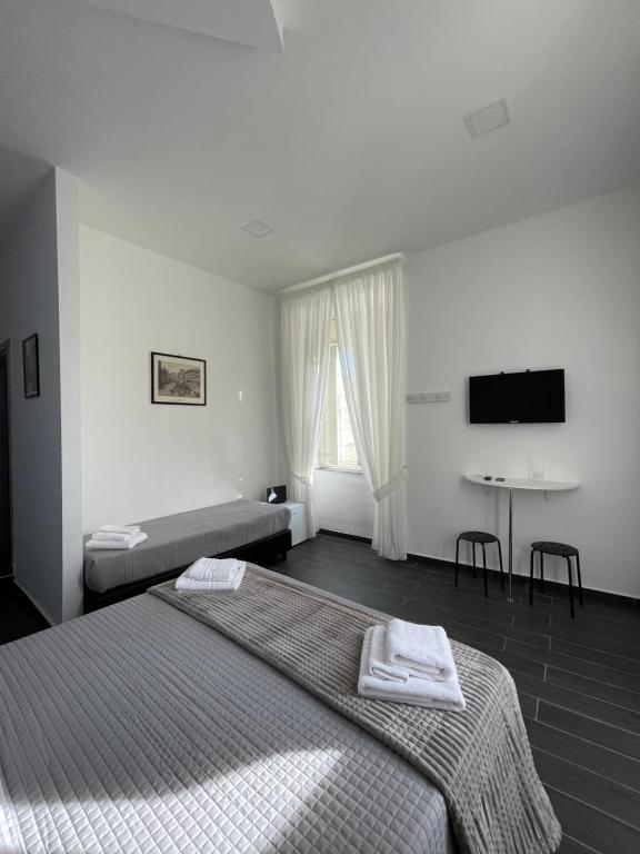 Posteľ alebo postele v izbe v ubytovaní Le Porte di Napoli - Rooms