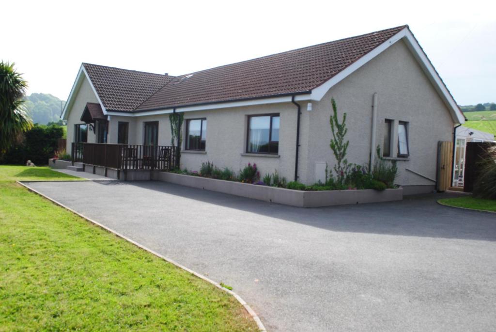 a house with a driveway in front of it at Arley House B & B in Dundrum