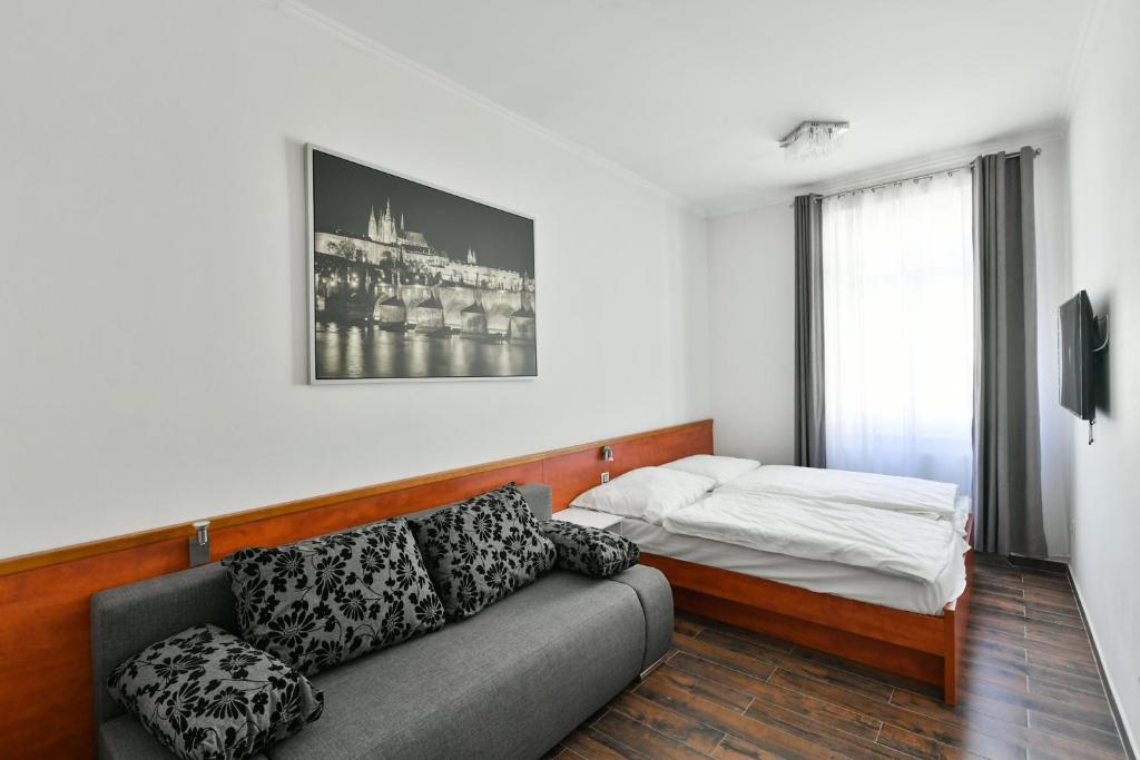 Postel nebo postele na pokoji v ubytování Apartmány Na Náměstí 85
