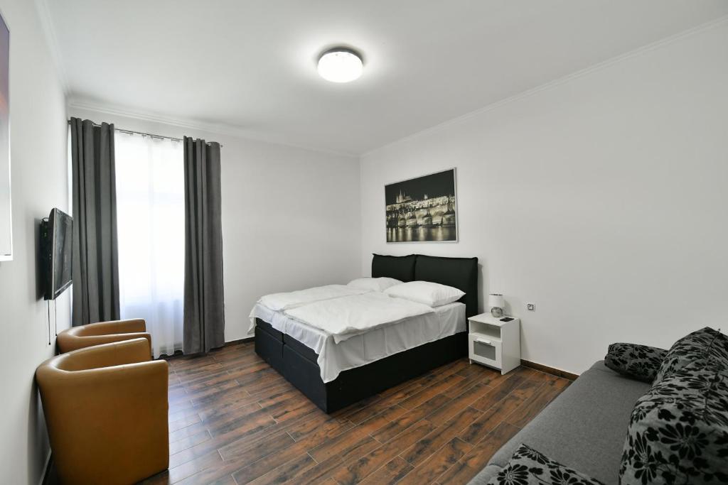 Postel nebo postele na pokoji v ubytování Apartmány Na Náměstí 85