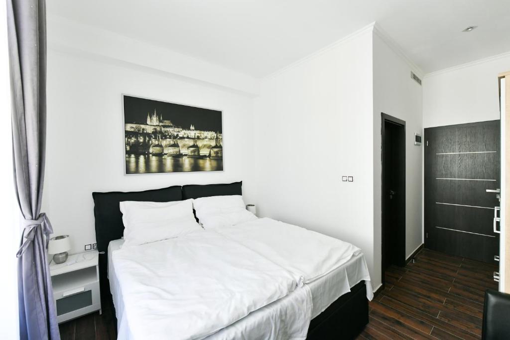Postel nebo postele na pokoji v ubytování Apartmány Na Náměstí 85