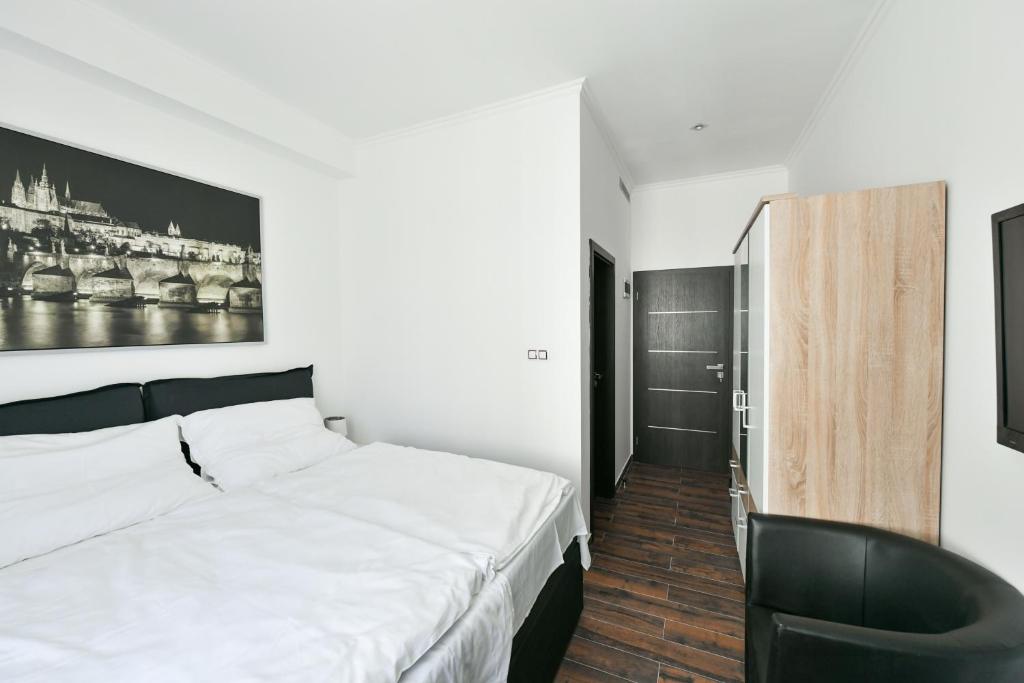 Postel nebo postele na pokoji v ubytování Apartmány Na Náměstí 85