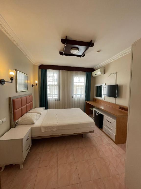 Postel nebo postele na pokoji v ubytování Arden Hotel
