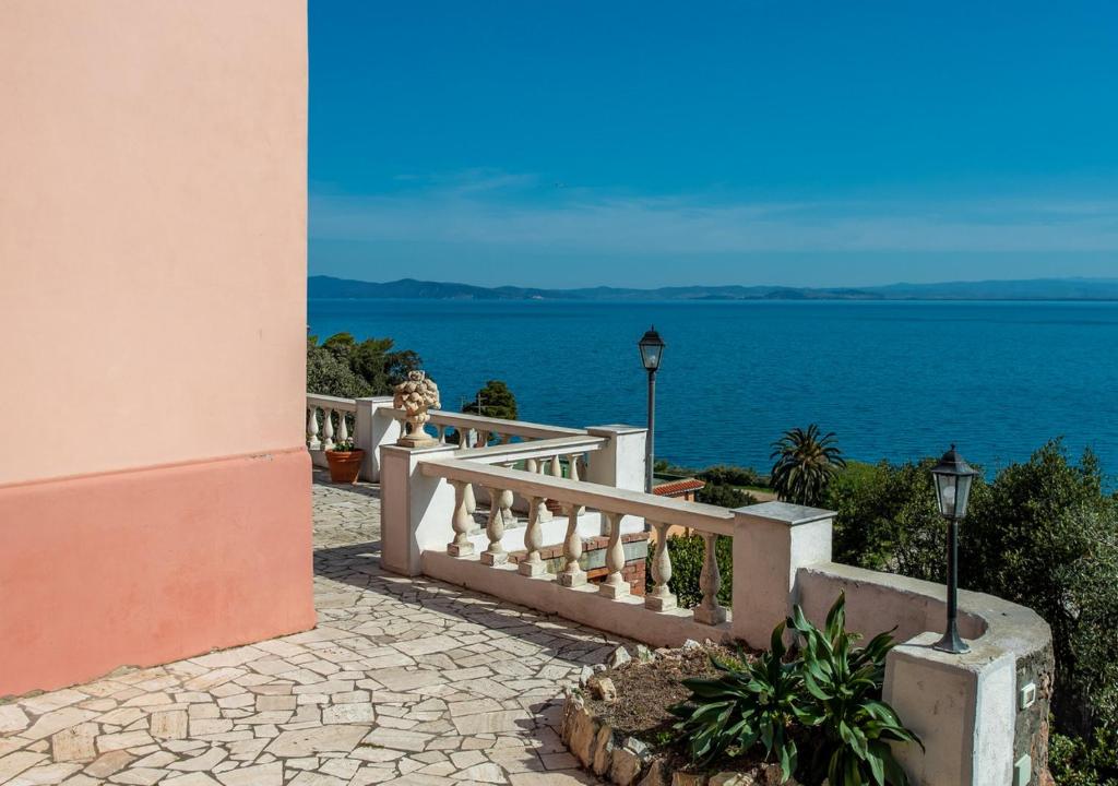 a staircase with a view of the ocean at Casa Alessia in Porto Santo Stefano