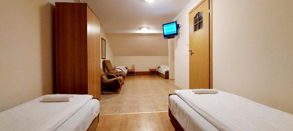 Posteľ alebo postele v izbe v ubytovaní Motel Panorama