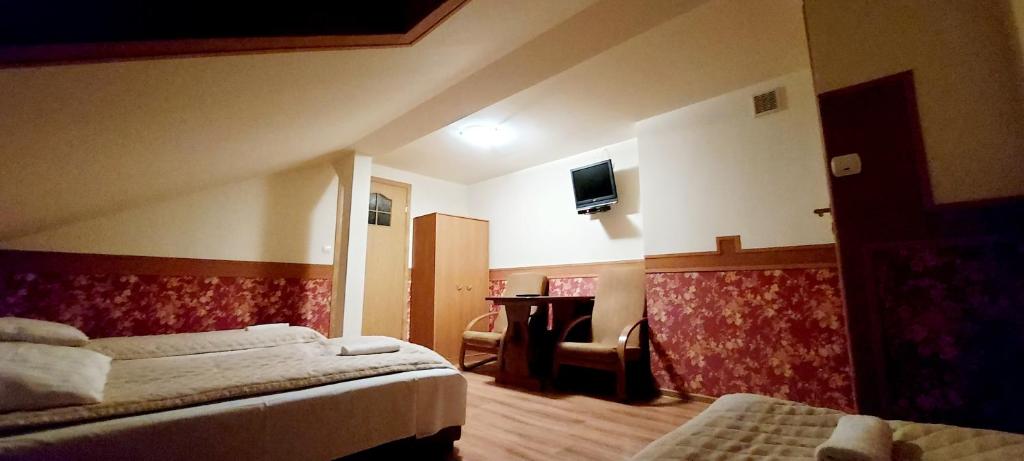 Posteľ alebo postele v izbe v ubytovaní Motel Panorama