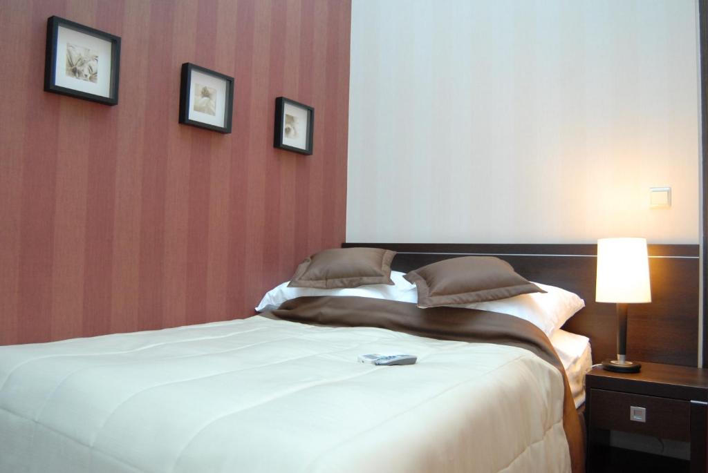 Postel nebo postele na pokoji v ubytování Hotel Pik