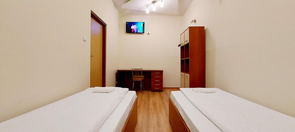 Posteľ alebo postele v izbe v ubytovaní Motel Panorama