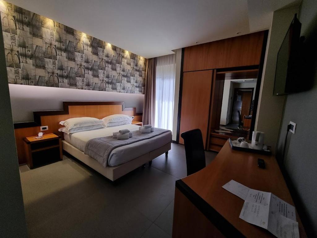 Postel nebo postele na pokoji v ubytování Hotel Olimpia